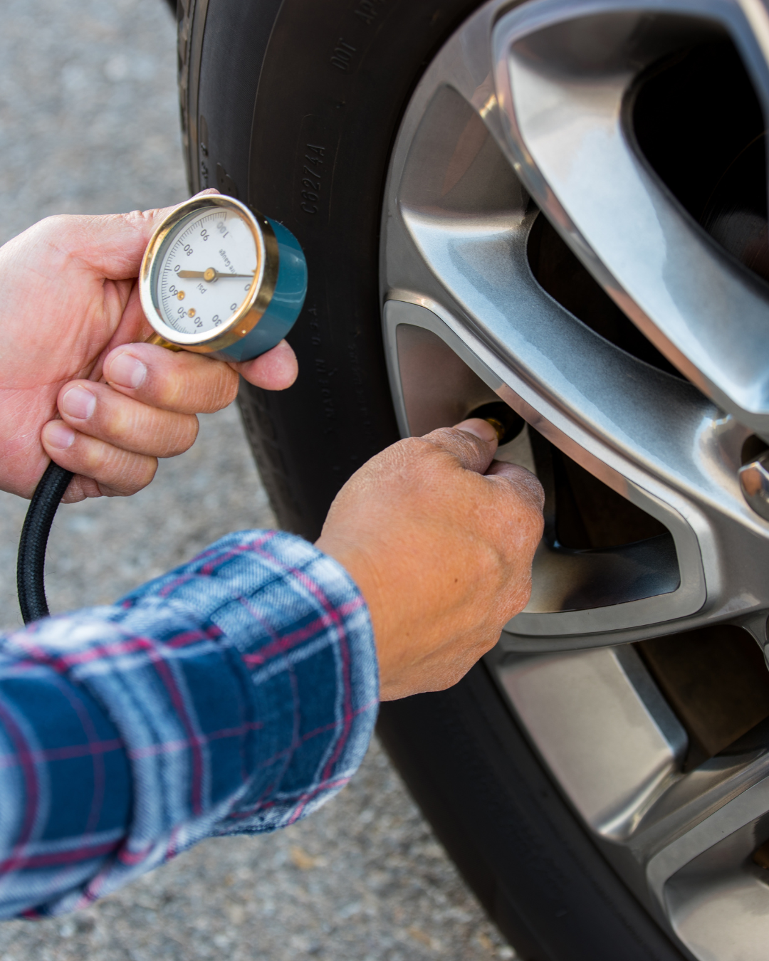 NY driver checking tire pressure at home